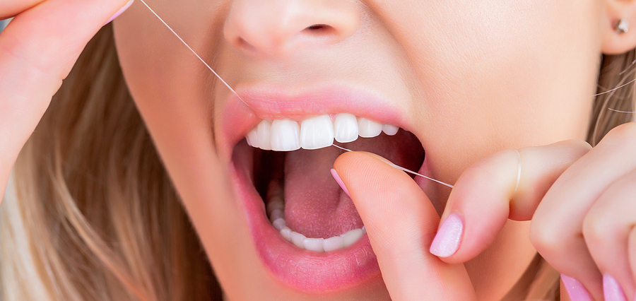 FLOSSING THOSE PEARLY WHITES PROPERLY