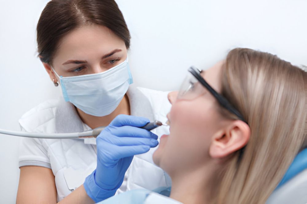 a woman is getting dental treatment
